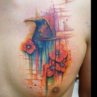 Watercolor style big chest tattoo of humming bird and flowers