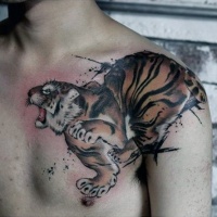 Watercolor style chest and shoulder tattoo of tiger