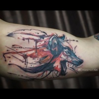 Watercolor style colored biceps tattoo of evil wolf