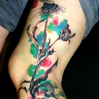 Watercolor style colored blooming tree with bird