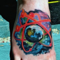 watercolor style colored foot tattoo of small atom with planet