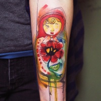 Watercolor style colored forearm tattoo of Matryoshka doll