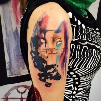 Watercolor style colored shoulder tattoo of cat silhouette