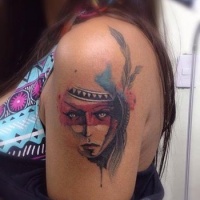 Watercolor style colored shoulder tattoo of Indian woman with feather