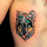 Watercolor style colored side tattoo of small wolf portrait