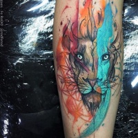 Watercolor style colored tattoo of flames shaped lion head