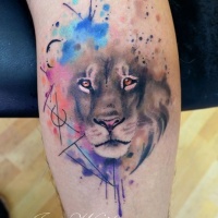 Watercolor style colored tattoo of lion with mystical symbols