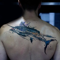 Watercolor style colored upper back tattoo of enormous fish