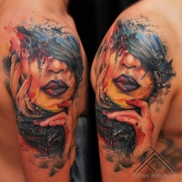 Watercolor style colorful shoulder tattoo of woman portrait