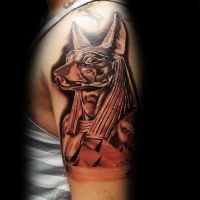 Watercolor style cool looking shoulder tattoo of Egypt God statue