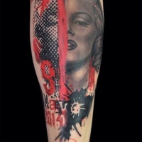 Watercolor style impressive looking forearm tattoo of Merlin Monroe face with lettering