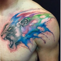 Watercolor style large collarbone tattoo of roaring colorful lion