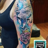 Watercolor style large half sleeve tattoo of lion with rose