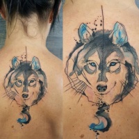Watercolor style nice looking upper back tattoo of wolf portrait