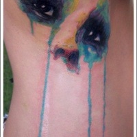 acquerello stile dipinto stilizzato multicolore occhi mistici tatuaggio su lato