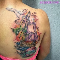 Watercolor style shoulder tattoo of sailing ship, compass and bird