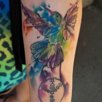Watercolor tattoo bird on leg