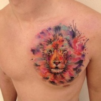 Watercolor lion head tattoo on chest