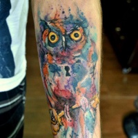 Watercolor tattoo owl on arm