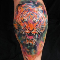 Watercolor roaring tiger tattoo on leg
