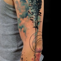 Watercolor tree tattoo on arm