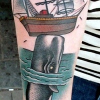 Whale and ship tattoo on arm by Jonas Uggli
