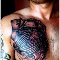 Wires and electrical tape tattoo on chest