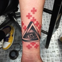 Wonderful colored triangle shaped symbol with human eye tattoo on forearm combined with red crosses