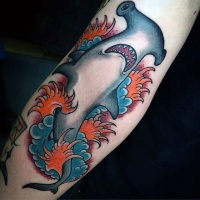 Wonderful hammerhead shark in water waves colored old school style tattoo