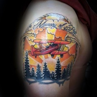 Wonderful illustrative style shoulder tattoo of flying plane with forest and lettering
