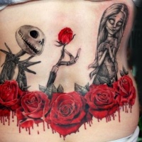 eccezionale dipinto eroe mostro cartone animato con fiori sanguinante tatuaggio su parte bassa della schiena