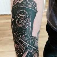 WW2 themed illustrative style forearm tattoo of creepy soldier