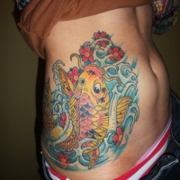 Yellow koi fish tattoo on ribs