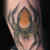 Yellow spider tattoo on arm