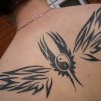 Yin yang and wings tattoo