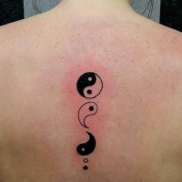 Yin Yang special Asian symbol and it's pieces black and white spine tattoo