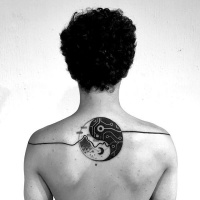 Yin Yang symbol like black ink upper back tattoo