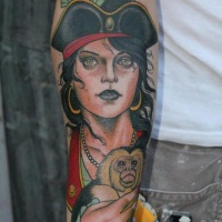 Young woman with a monkey pirate tattoo by hakan havermark