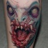 3D detailed unfinished colored monster face tattoo on leg