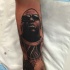 3D portrait style very detailed forearm tattoo of man face in sunglasses