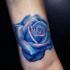 3D style amazing detailed leg tattoo of blue rose
