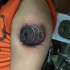 3D style black ink shoulder tattoo of money bill roll