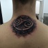 3D style black ink upper back tattoo of Celtic symbol