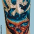 3D style colored ankle tattoo of glowing skull