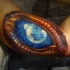 3D style colored biceps tattoo of fantasy eye with space