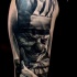 3D style creepy looking shoulder tattoo of maniac clown with knife