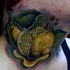 3D style very detailed neck tattoo of ripped lemon with leaves
