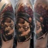 3D style very detailed shoulder tattoo of Indian skull with feather helmet