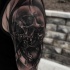 3D style very detailed shoulder tattoo of human skull with clock