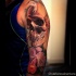 3D style very detailed side tattoo of human skull with beautiful flowers